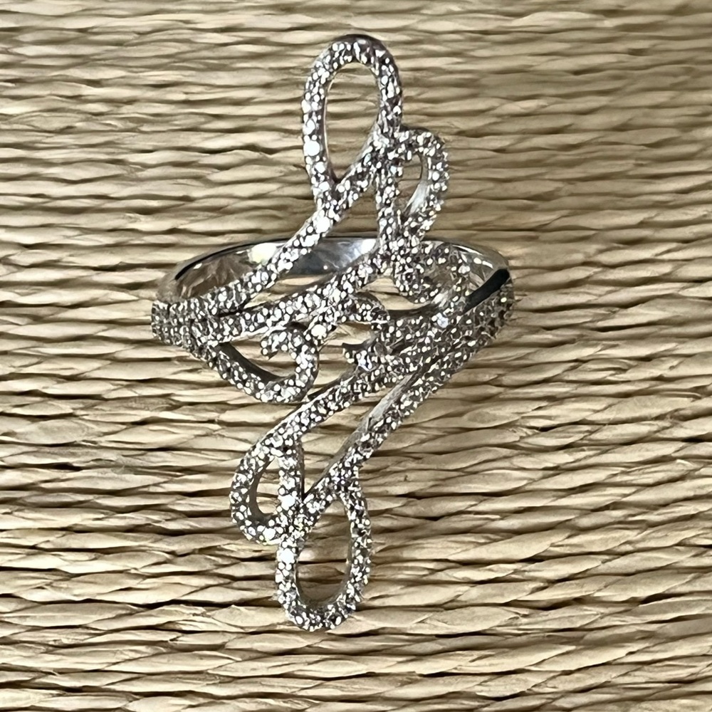 PRE-LOVED GENUINE STERLING SILVER WITH SWIRLS OF DIAMONDS AROUND THIS RING